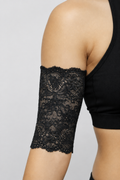 Black lace PICC line cover fitted to a model’s upper arm